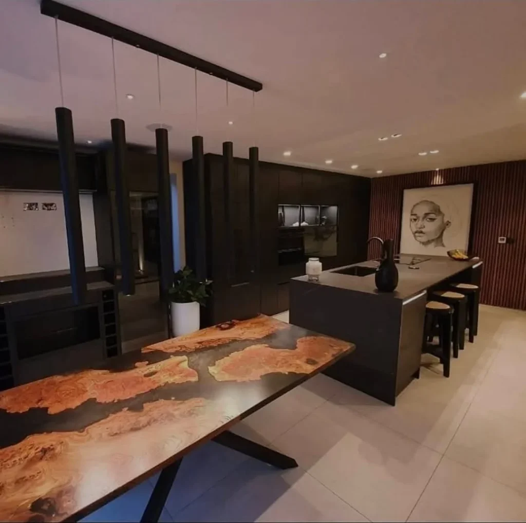https://fixandflip.sdsdigitalsolutions.com/wp-content/uploads/2026/08/bespoke-live-edge-dining-table-dark-kitchen-wide-1024x1018.webp