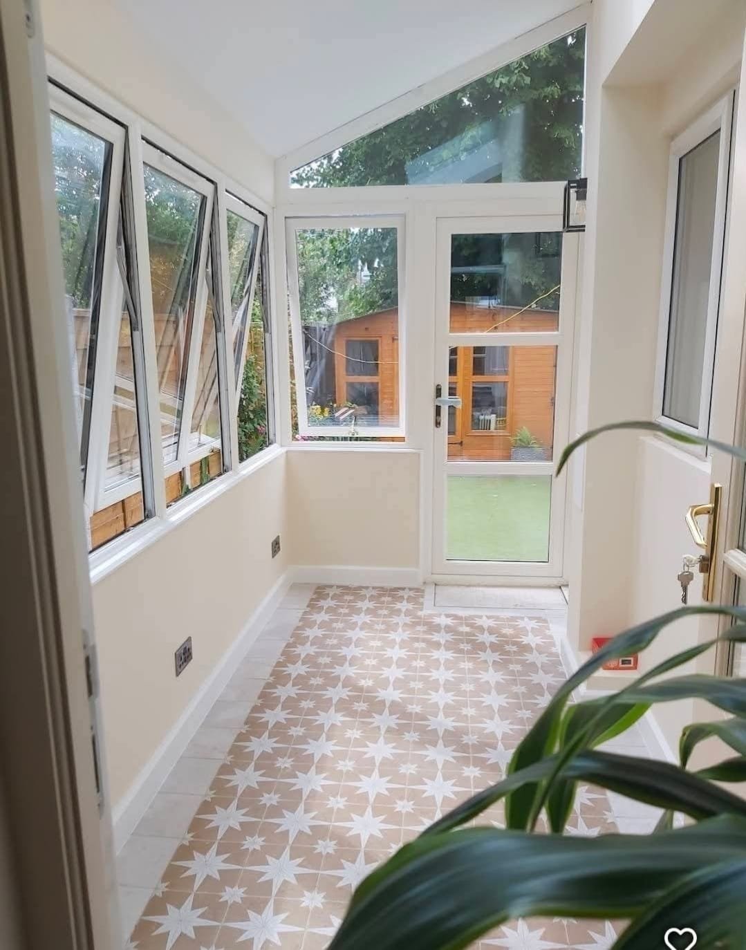 https://fixandflip.sdsdigitalsolutions.com/wp-content/uploads/2026/08/garden-room-extension-patterned-tile-floor.jpg
