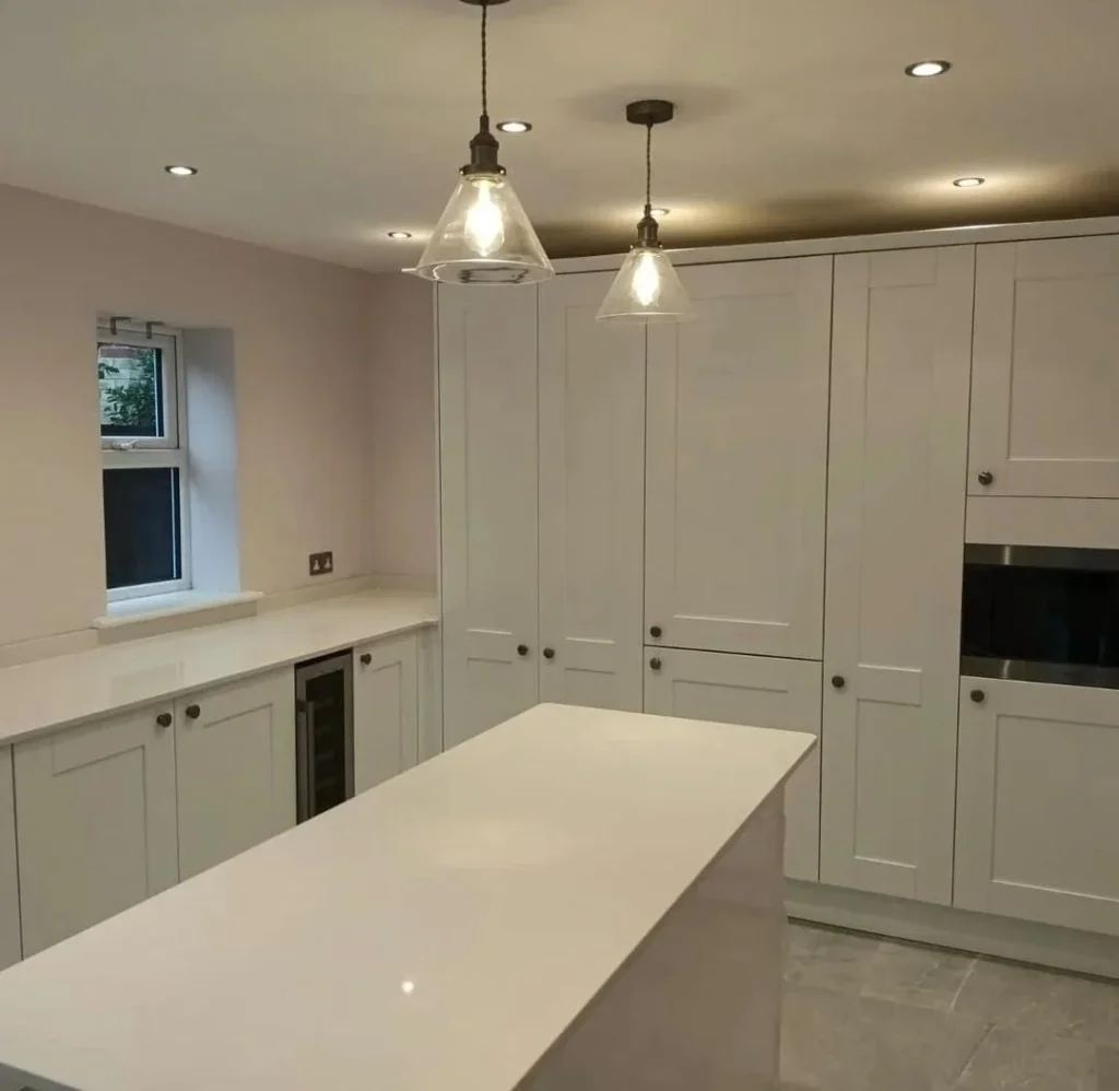 https://fixandflip.sdsdigitalsolutions.com/wp-content/uploads/2026/08/white-shaker-kitchen-island-pendant-lighting-1024x998.webp